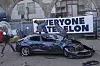 An old Tesla car that was due to be scrapped is hit at an event staged to protest against Elon Musk by the group 'Everyone Hates Elon' in London on April 10. [AP/YONHAP]