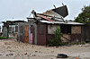 A house stands damaged by the preliminary winds of Hurricane Melissa at Hellshire Fishing Beach in Portmore, Jamaica, Oct. 27. Jamaican Prime Minister Andrew Holness said the government has a multifaceted plan to ensure a ″swift and effective″ response to the storm’s imminent impact on Monday night and forecast to be the island’s strongest recorded storm. [EPA/YONHAP]
