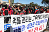 Members of an association of dog farmers protest the government's proposed dog meat ban in front of the presidential office in Yongsan, central Seoul, last November. The banner reads, ″The rights to eat is foremost!″ [YONHAP]