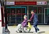 A patient and a guardian walk past an emergency room at a general hospital in Seoul on Wednesday. [YONHAP]