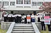 Medical professors and students from Kyungpook National University and Kangwon National University demand lawmakers working for the parliamentary education committee to accept their leave requests in Daegu on Thursday. [YONHAP]