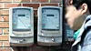 A pedestrian walks by an electric meter in Seoul on March 21. [YONHAP]