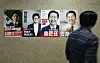 Posters of People Power Party presidential primary election candidates are hung up inside the National Assembly building in western Seoul on April 23. [JOONGANG ILBO]