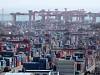 Trade containers are stacked at a container terminal in Busan Port on Feb. 22. [YONHAP]