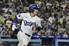Los Angeles Dodgers' Kim Hye-seong sprints toward first, watching his solo home run in the fifth inning of a baseball game against Oakland Athletics on May 14, in Los Angeles. [AP/YONHAP]