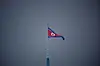 A North Korean flag flutters at the propaganda village of Gijungdong in North Korea, in this picture taken near the truce village of Panmunjom inside the demilitarized zone in South Korea on July 19, 2022. [REUTERS/YONHAP]