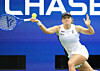 Iga Swiatek of Poland returns a ball to Amanda Anisimova of the United States during their women's singles quarterfinals match at the U.S. Open at the USTA Billie Jean King National Tennis Center in New York on Sept. 3. [UPI/YONHAP]