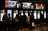 Moviegoers buy tickets at a theater in Seoul on March 2. [NEWS1]