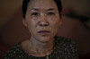 Yooree Kim, who was 11 when she was sent by an adoption agency to a couple in France, sits for a portrait as tears well up in her eyes in her apartment in Seoul on May 19, 2024. [AP/YONHAP]