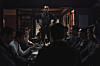 A scene from the film '12.12: The Day' shows military leader Chun Doo-kwang, center, played by actor Hwang Jung-min, talking to the members of hanahoe, an unofficial private society of military officers. [PLUS M ENTERTAINMENT]