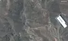 This satellite image provided by Maxar Technologies shows a closer view of a ridge at the Fordo enrichment facility in Iran before U.S. strikes, Friday, June 20. [AP/YONHAP]