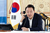 President Yoon Suk Yeol talks over the phone at his office in Seoul. [PRESIDENTIAL OFFICE]