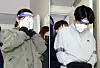 Lee Eun-hae, who murdered her then-husband, left, and Lee's affair partner, Cho Hyeon-soo, walk into the Incheon District Court for questioning in April 2022. [YONHAP]