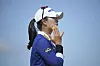 Kim A-lim applies cream to her face as she competes during the first round of the Women's British Open at Royal Porthcawl Golf Club in Porthcawl, Wales, on July 31. [AP/YONHAP]