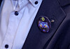 Badges featuring Derpy, a side character in Netflix's animated film ″KPop Demon Hunters,″ were handed out to reporters at President Lee Jae Myung's press conference marking his first 100 days in office at the Blue House in central Seoul on Sept. 11. [JOINT PRESS CORPS]