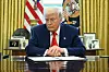 U.S. President Donald Trump prepares to sign an executive order in the Oval Office of the White House in Washington on April 9. [AFP/YONHAP]