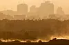 Military vehicles manoeuvre in Gaza, as seen from the Israeli side of the border, June 11, 2025. [REUTERS/YONHAP]