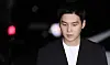BTS member Suga enters the Yongsan Police Station in central Seoul to be questioned by police on his DUI allegation on Aug. 23. [NEWS1]