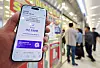 A notice about USIM replacement reservations is posted at an SK Telecom retail store in Seoul on April 28 as the company begins offering a free USIM replacement service following the hacking incident involving customer information. [YONHAP]