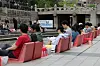 People read books at Seoul's outdoor library set along the Cheonggye Stream in Jongno District, downtown Seoul, on April 21, 2024. [YONHAP]