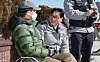 Kwon Jong-ho, a senior police inspector, talks with an elderly man while patroling a public park in Busan on Feb. 20. [SONG BONG-GEUN]