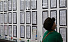 A job seeker reads job notices at an employment center in Mapo District, western Seoul, on June 26. [YONHAP]