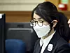 Kim Keon Hee closes her eyes as she appears for the first hearing for her corruption charges at the Seoul Central District Court in Seocho District, southern Seoul, on Sept. 24. [NEWS1]
