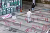 A student walks across the Dongduk Women's University campus, with lacquer paint sprayed on the ground, on Nov. 24, 2024. [YONHAP]