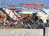 Fire authorities search for remains among the debris of the crashed Jeju Air plane separated by smashed localizers at Muan International Airport in South Jeolla on Dec. 31. [YONHAP]