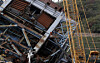 A crane secures the upper structure of a boiler tower at a thermal power plant operated by Korea East-West Power on Nov. 12, after its collapse on Nov. 6. [NEWS1]