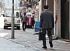 A man in a suit walks along a street in Seoul on May 26. [YONHAP]