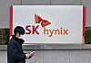 A man walks past the logo of SK hynix outside the company's Bundang office in Gyeonggi on Jan. 26. [YONHAP]