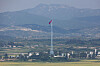 A North Korean flag flies over Kijong-dong in the Demilitarized Zone’s western front, seen from the Dora Observatory in Paju, Gyeonggi, on Sept. 3. [YONHAP]