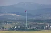 A North Korean flag flies over Kijong-dong in the Demilitarized Zone’s western front, seen from the Dora Observatory in Paju, Gyeonggi, on Sept. 3. [YONHAP]