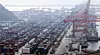 Shipping containers are stacked at Busan Port on Dec. 1. [YONHAP]