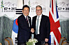 President Lee Jae Myung, left, shakes hands with British Prime Minister Keir Starmer at the G7 summit in Kananaskis, Alberta, in Canada on June 17. [JOINT PRESS CORPS]