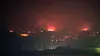 Flames rise over the coastal village of Seok-ri in Yeongdeok County, North Gyeongsang on March 29, as a wildfire that began in Uiseong spreads with strong winds. [NEWS1]