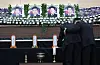 Grieving family members weep in front of the portraits of the four victims of the Navy patrol aircraft crash at the joint memorial altar, set up at the Navy Air Command gymnasium in Pohang, North Gyeongsang, on May 30. [YONHAP]
