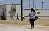 Immigrants seeking asylum walk at the ICE South Texas Family Residential Center, Aug. 23, 2019, in Dilley, Texas. [AP/YONHAP]