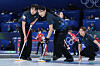 Seol Ye-eun, left, and Kim Min-ji of Korea sweep the ice during a round-robin match against Switzerland in the women's curling tournament at the Winter Olympics at the Cortina Curling Olympic Stadium in Cortina d'Ampezzo, Italy, on Feb. 17.  [YONHAP]