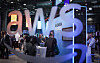 Visitors are seen at the booth of Amazon Web Services (AWS) during the opening of the Hannover Messe industrial trade fair for mechanical and electrical engineering and digital industries in Hanover, Germany, on March 31. [AFP/YONHAP]