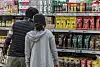 Shoppers inspect instant coffee mixes displayed at a discount mart in southern Seoul on April 2. [YONHAP]