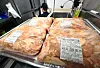 Packets of chicken seen at a restaurant in Seoul on May 20 [YONHAP]
