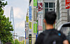 A person walks past private cram schools in Dogok-dong, Gangnam District, southern Seoul, on July 23. [WOO SANG-JO]