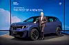 Oliver Zipse, the chairman of BMW, poses for a photo with the latest iX3 during an unveiling media event in Munich on Sept. 5. [BMW]