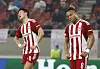 Olympiacos' Hwang Ui-jo, left, and Pierre Kunde react during a Europa League game against Nantes at Karaiskaki Stadium in Piraeus, Greece on Nov. 3, 2022. [REUTERS/YONHAP]