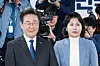 Lee Jae-myung, left, and his wife Kim Hye-kyung pose for a photograph after Lee was elected as a lawmaker representing Incheon's Gyeyang-B district in the general election in April 2024. [JUN MIN-KYU]
