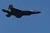 KF-21 Boramae fighter jet flying across a clear blue sky