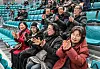 Members of the Wonju City Public Relations Committee watch the ice hockey at the Gangneung Ice Centre in Gangneung, Gangwon on Monday. [YONHAP]