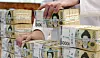 An employee arranges stacks of 50,000-won ($34) bank notes at Hana Bank's Counterfeit Notes Response Center in Jung District, central Seoul, on July 17, 2024. [NEWS1]